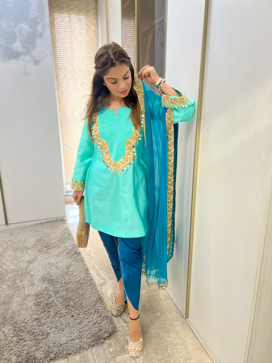 “Radiant turquoise mirror-work ensemble with sparkling embellishments – Indian festive outfit for women”
